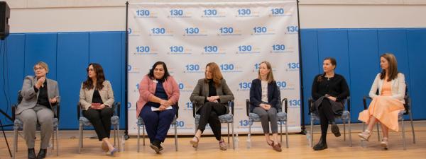 panelists sitting on stage